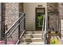 Close-up of steps and stylish railings lead to a welcoming townhome entrance at 383 Pratt Se Dr # 504, Atlanta, GA 30315