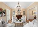 Comfortable seating arrangement under a stylish chandelier with bright natural light at 4223 Millside Se Walk, Smyrna, GA 30080