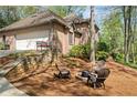 Outdoor firepit area with seating, perfect for relaxing and enjoying the outdoors at 5520 Glen Errol Rd, Atlanta, GA 30327