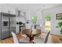 Eat-in kitchen boasts stainless steel appliances and backyard access at 912 Fairburn Nw Rd, Atlanta, GA 30331
