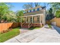 Charming two-story home with a well-maintained front yard and inviting brick steps leading to the covered porch at 195 Childs Nw Dr, Atlanta, GA 30314