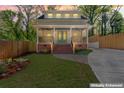 Charming two-story home with a well-maintained front yard and inviting brick steps leading to the covered porch at 195 Childs Nw Dr, Atlanta, GA 30314