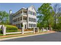Charming three-story house with black shutters, white trim and beautiful landscaping at 3890 The Battery, Duluth, GA 30096