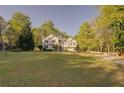 Well-maintained two-story home with a large front lawn and ample landscaping at 209 Red Fern Ct, Canton, GA 30114