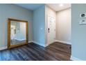 Bright entryway featuring hardwood floors and a large decorative mirror at 2465 Rockcliff Se Rd, Atlanta, GA 30316
