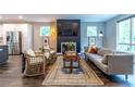 Open-concept living room with a fireplace and lots of natural light at 2465 Rockcliff Se Rd, Atlanta, GA 30316