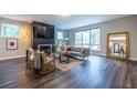 Comfortable living room area with large windows and wood flooring at 2465 Rockcliff Se Rd, Atlanta, GA 30316