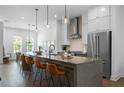 Spacious kitchen with a large island and a breakfast bar with stylish pendant lighting at 2614 Talley St, Decatur, GA 30030