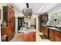 Kitchen with dark wood cabinets, granite countertops, and a center island at 4941 N Helton Rd, Winston, GA 30187