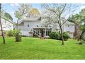 Expansive backyard featuring a well-manicured lawn and a multi-level deck, perfect for outdoor entertaining and relaxation at 4086 Norton Se Pl, Smyrna, GA 30082