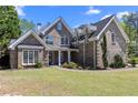 Attractive brick home featuring a well-maintained front lawn at 774 Mary Ann Ne Dr, Marietta, GA 30068