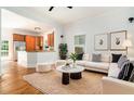 Open-concept living area with hardwood floors connecting the living room to the kitchen at 1065 Wylie Se St, Atlanta, GA 30316