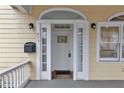 Close-up of the front door, showcasing the entrance with sidelights and a transom window at 873 Monroe Ne Cir, Atlanta, GA 30308