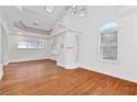 Bright living room with hardwood floors, high ceilings, and many windows providing ample natural light at 873 Monroe Ne Cir, Atlanta, GA 30308