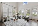 Elegant living room with tall ceilings, plush seating, and ample natural light at 530 Bismark Ne Rd, Atlanta, GA 30324