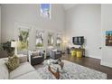 Bright living room with high ceilings, large windows and modern decor at 530 Bismark Ne Rd, Atlanta, GA 30324