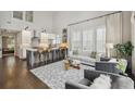 Open living space with modern kitchen featuring a center island and bar stool seating at 530 Bismark Ne Rd, Atlanta, GA 30324