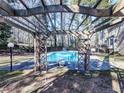 Backyard pool area with a pergola and deck, perfect for outdoor entertaining at 2311 October Nw Ct, Acworth, GA 30102