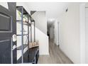 Bright entryway featuring wood floors, bench, and staircase at 2693 Greentree Se Dr, Marietta, GA 30067