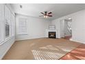 Spacious living room featuring a fireplace, large windows, and a neutral color palette at 2732 Pierce Brennen Ct, Lawrenceville, GA 30043