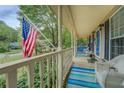 Spacious front porch with comfortable seating, perfect for enjoying the outdoors at 293 Country Lake Dr, Mcdonough, GA 30252