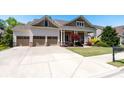 Beautiful home with a three-car garage, a well-manicured lawn, and wide driveway with a basketball hoop at 3137 Perimeter Cir, Buford, GA 30519