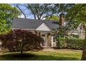 Cozy home with a lush front yard, featuring a beautiful Japanese maple and a stone-accented entryway at 1010 Eden Se Ave, Atlanta, GA 30316