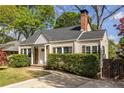 Inviting single-story house with a well-kept lawn and quaint exterior features, including wood shutters at 1010 Eden Se Ave, Atlanta, GA 30316