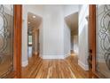 Spacious foyer with hardwood floors and decorative glass double doors at 2141 Abby Ne Ln, Atlanta, GA 30345