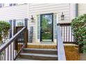 Eye-level shot of the front door with glass and sidelights flanked by matching wall lanterns at 4270 Parnell Rd, Marietta, GA 30062