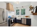 Charming kitchen features custom cabinets, stainless steel appliances, and an undermount apron sink at 21 Peachtree Memorial Nw Dr # 12, Atlanta, GA 30309
