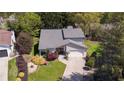 Aerial view of a charming home showcasing its well-maintained landscaping and double-door entryway at 890 Muirfield Rdg, Marietta, GA 30068