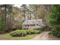 Inviting two-story home surrounded by mature trees and colorful azaleas at 2962 Moorings Pkwy, Snellville, GA 30039