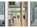 Bright, open-concept living room with floor-to-ceiling windows and modern finishes, offers natural light and stunning views at 2650 Fairoaks Rd, Decatur, GA 30033