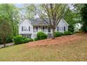 Lovely home with meticulous landscaping, beautiful lawn, and cozy front porch at 350 Spring View Ct, Dallas, GA 30157