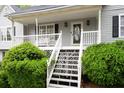 Close up showcasing the porch, steps, railing and meticulous landscaping at 350 Spring View Ct, Dallas, GA 30157