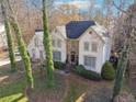Stunning two-story home with a combination of stucco and stone facade, set amidst lush greenery and mature trees at 760 Woodrow Dr, Lawrenceville, GA 30043