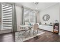 Elegant dining room with modern chandelier, large window, and elegant finishes at 245 Fairview Cir, Roswell, GA 30076
