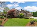 Beautiful backyard with lush green lawn and manicured landscaping, creating a private oasis at 2114 Castlewycke Ct, Marietta, GA 30068