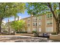 Attractive exterior of building with well-manicured lawn and mature trees providing shade at 244 13Th Ne St # 310, Atlanta, GA 30309