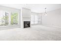 Bright living room featuring a fireplace and natural lighting at 244 13Th Ne St # 310, Atlanta, GA 30309