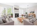 Cozy living room featuring a fireplace and comfortable gray furniture at 244 13Th Ne St # 310, Atlanta, GA 30309