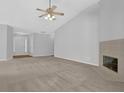 Spacious living room features a fireplace, high ceilings, and neutral carpet at 1112 Autumn Glen Way, Dacula, GA 30019