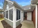 Inviting entrance with a screened-in porch, brick accents, and a well-lit doorway at 2252 Carefree Cir # 3, Marietta, GA 30062
