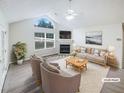 Bright living room featuring a fireplace, large windows, and neutral decor with cathedral ceiling at 2252 Carefree Cir # 3, Marietta, GA 30062