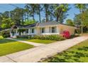 Charming white brick home with mature trees and manicured lawn at 3365 Ardley Sw Rd, Atlanta, GA 30311