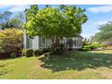 A lovely view of the home's side exterior and well-manicured garden at 5381 Fawn Meadow Ln, Powder Springs, GA 30127