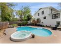 Inviting backyard oasis featuring a private pool, spa, and spacious patio for outdoor living at 503 Duke Dr, Marietta, GA 30066