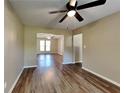 Inviting living space with wood-look floors, neutral paint, and easy access to other areas of the home at 955 Laurel Mill Dr, Roswell, GA 30076