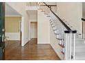 Spacious foyer with hardwood floors, staircase and elegant design at 770 Raleigh Sw Ct, Marietta, GA 30064